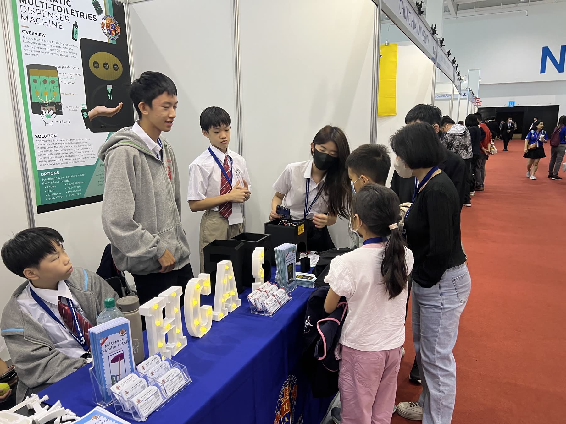 Demonstrating the dispenser to visitors